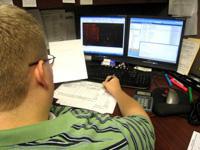 Team member, Brent, puts finishing touches on a CAD drawing