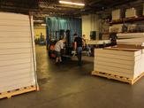 FedTech employee help load spill containment devices using a forklift