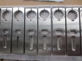 Multiple stainless steel parts wait to be assembled for diary application