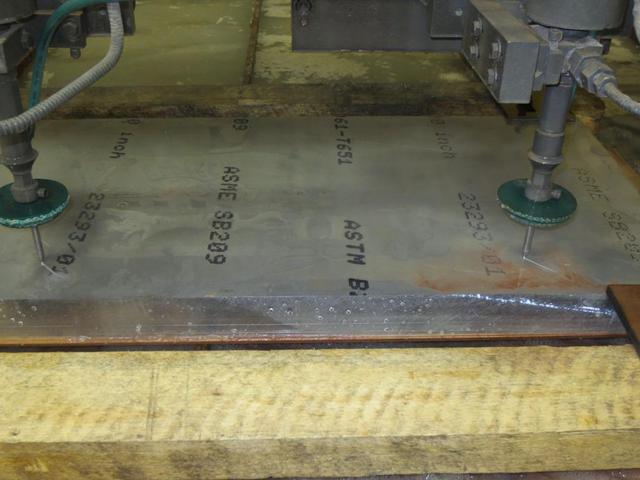 Drills cut into aluminum fixture