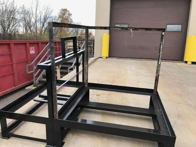 A close up view of the frame of a battery wash down station