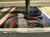 A high pressure waterjet prepareds to work on a holographic sheet