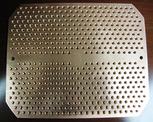 A close up view of a custom perforated plate