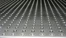 A close up view of a custom perforated plate