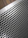 A close up view of a custom perforated plate