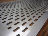 A close up view of a custom perforated plate