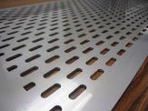 A close up view of a custom perforated plate