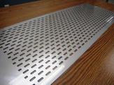A close up view of a custom perforated plate