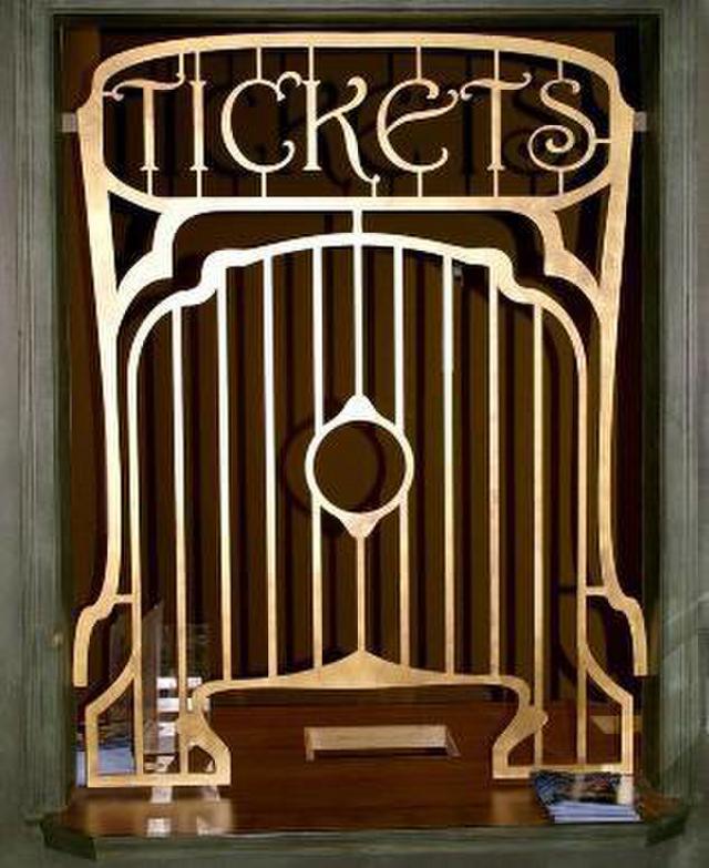 An up close view of a old custom ticket window