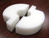 A close up view of a acetal wheel conveyor piece