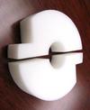 A close up side view of an acetal wheel conveyor piece